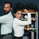 half-length-image-business-colleagues-showing-muscles-camera-fight-genders-concept_549566-657
