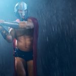 muscular-wet-spartan-attacking-with-blade_651396-774